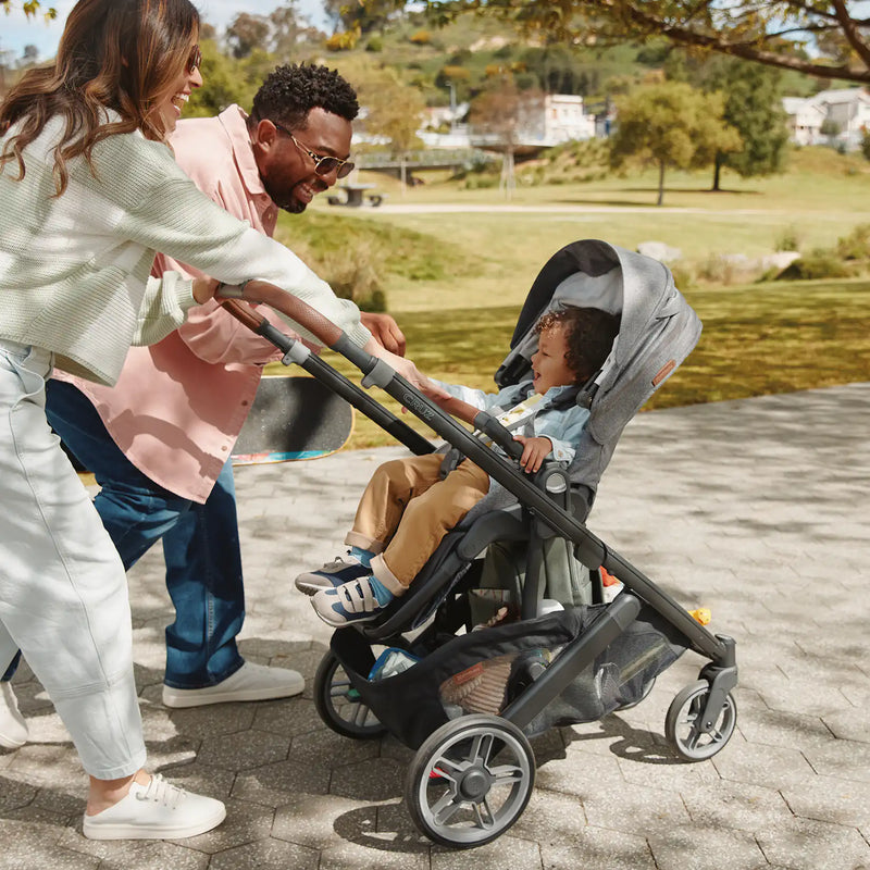 Cruz V3 stroller frame from UPPAbaby shown folded — a lightweight compact stroller ready for travel.