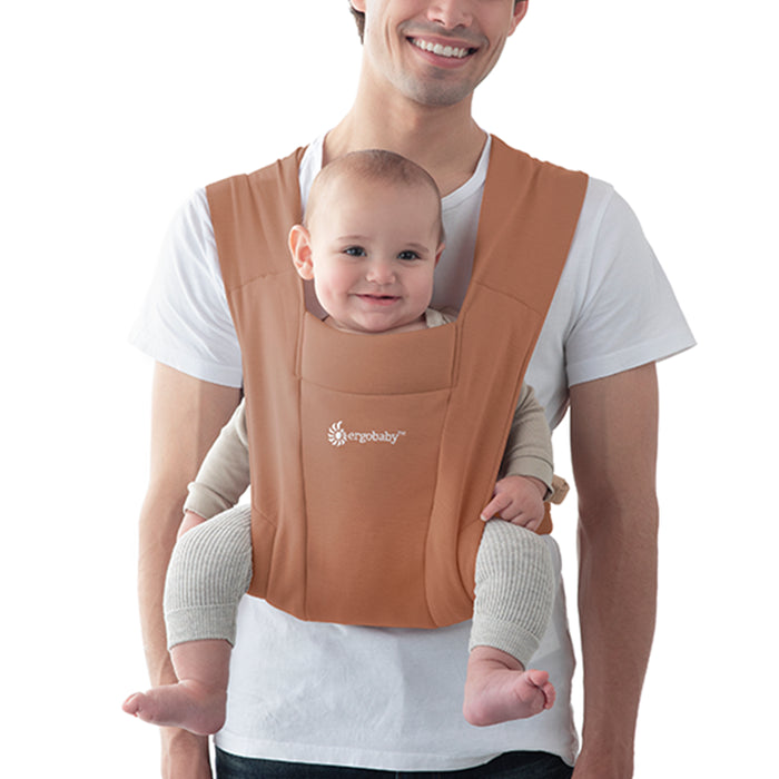 Comfort and ease meet in the Canyon Clay Ergobaby Embrace Newborn Carrier, a cozy front baby carrier for new parents.