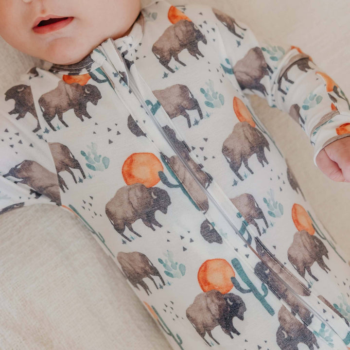Close up of Copper Pearl Bison baby pajamas, soft infant sleepwear with stretch fabric for movement and comfort