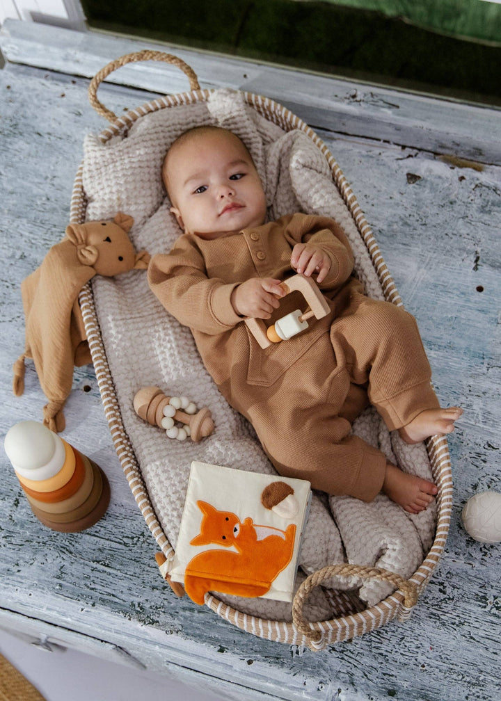 Colorful and sensory-rich, the Coco Village Baby First Toys Gift Box introduces babies to texture, sound, and shape through hands-on exploration.
