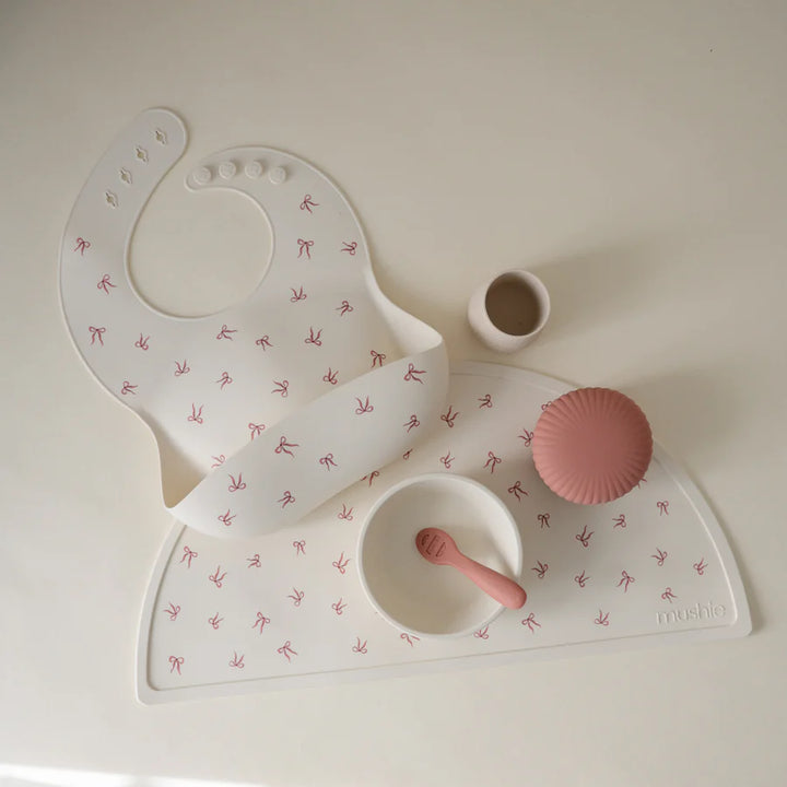 Pretty Pink Bows Mushie Silicone Placemat offers the best placemats choice for kids and parents alike.