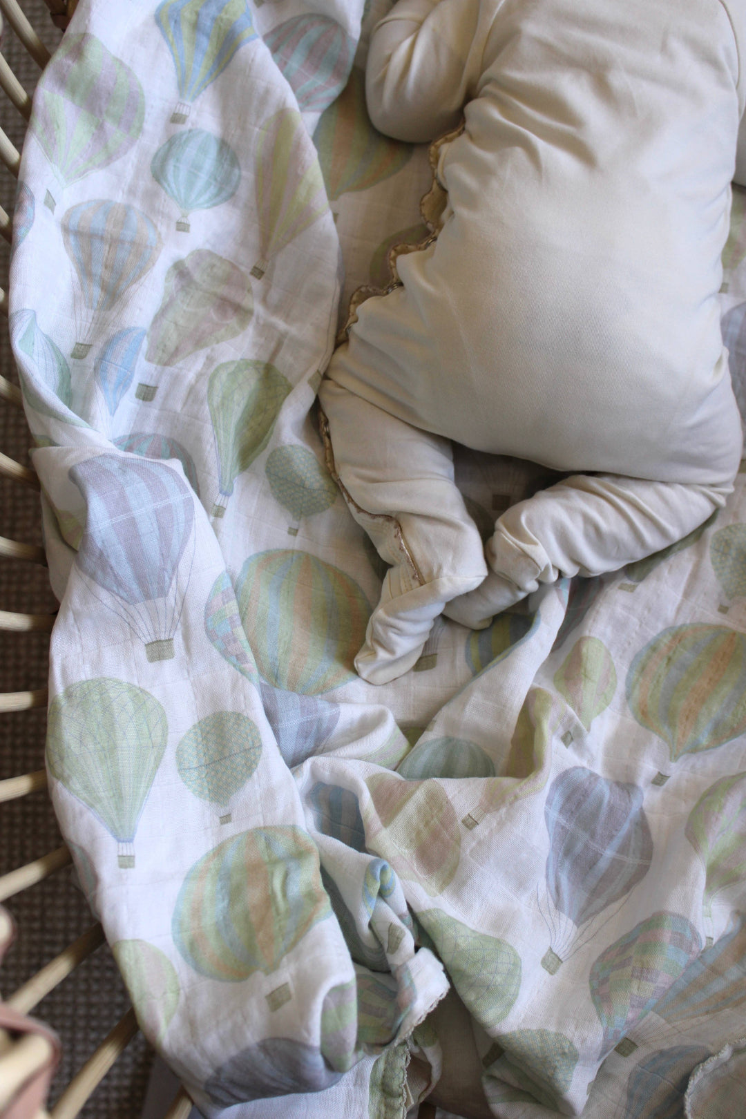 Close up of Little Threads air balloon muslin swaddle fabric, organic cotton baby blanket with breathable texture for sensitive skin