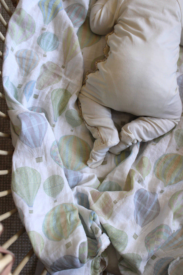 Close up of Little Threads air balloon muslin swaddle fabric, organic cotton baby blanket with breathable texture for sensitive skin