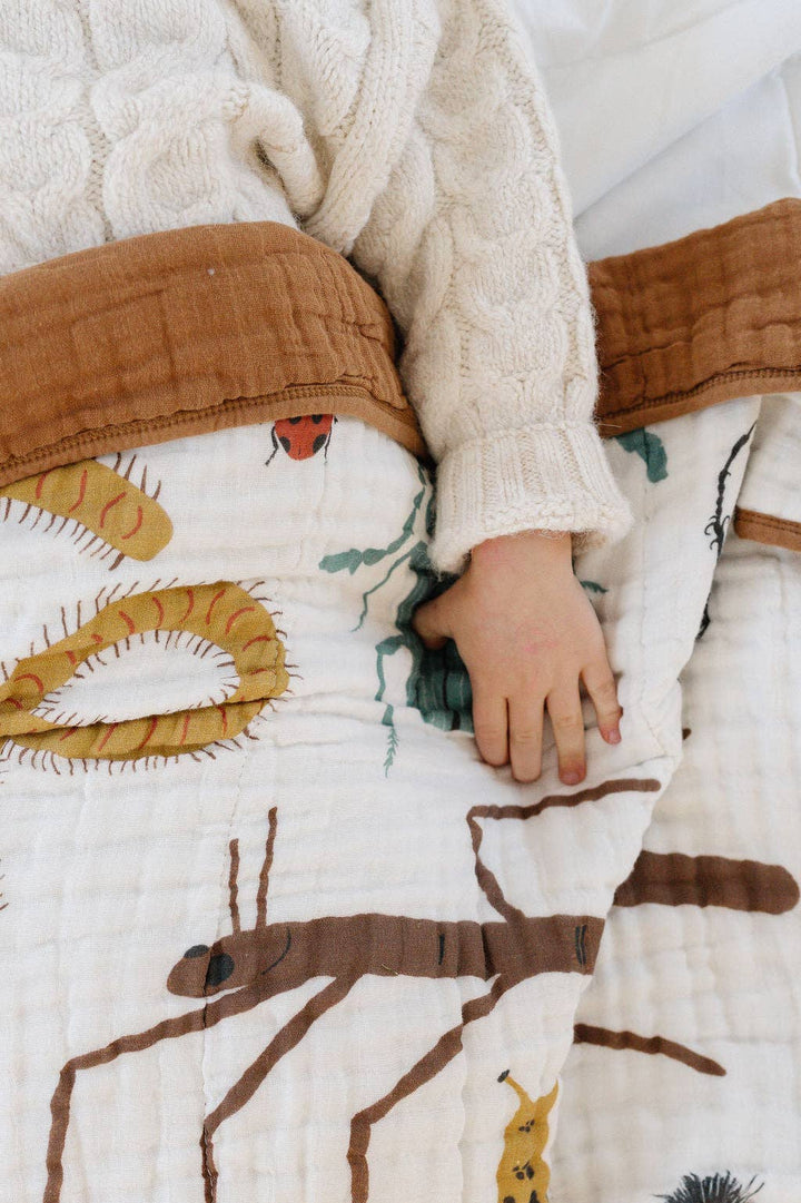 Gentle infant muslin blankets from Clementine Kids Cutie Crawlies Quilt make cozy naptime essential for little ones.