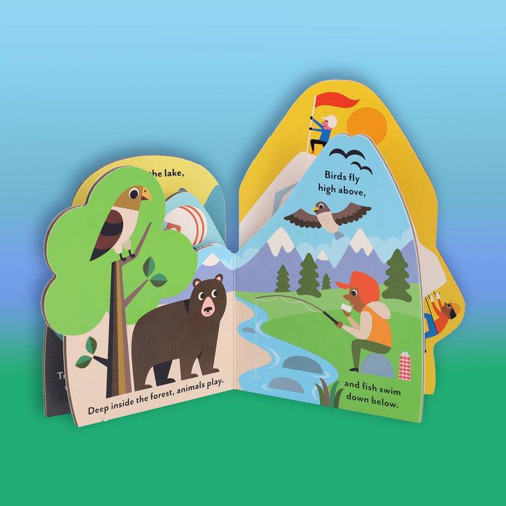 toddler board book page with pine trees and trail markers from Chronicle Books great outdoors series