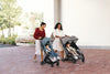 Side view of UPPAbaby Minu V3 Dillan baby stroller, group setting. A top choice for urban and suburban parents.