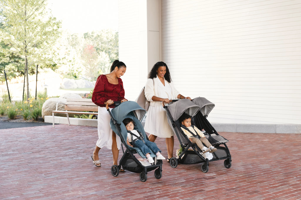 Side view of UPPAbaby Minu V3 Dillan baby stroller, group setting. A top choice for urban and suburban parents.