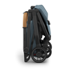 Foldable and compact, the UPPAbaby Minu V3 in Dillan is the best umbrella stroller for families.