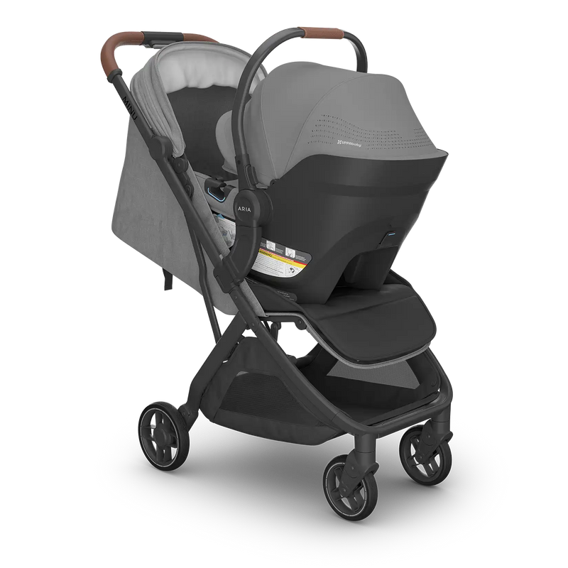 side angle of UPPABABY minu v3 single stroller with aria v2 lightweight infant car seat attached in greyson grey