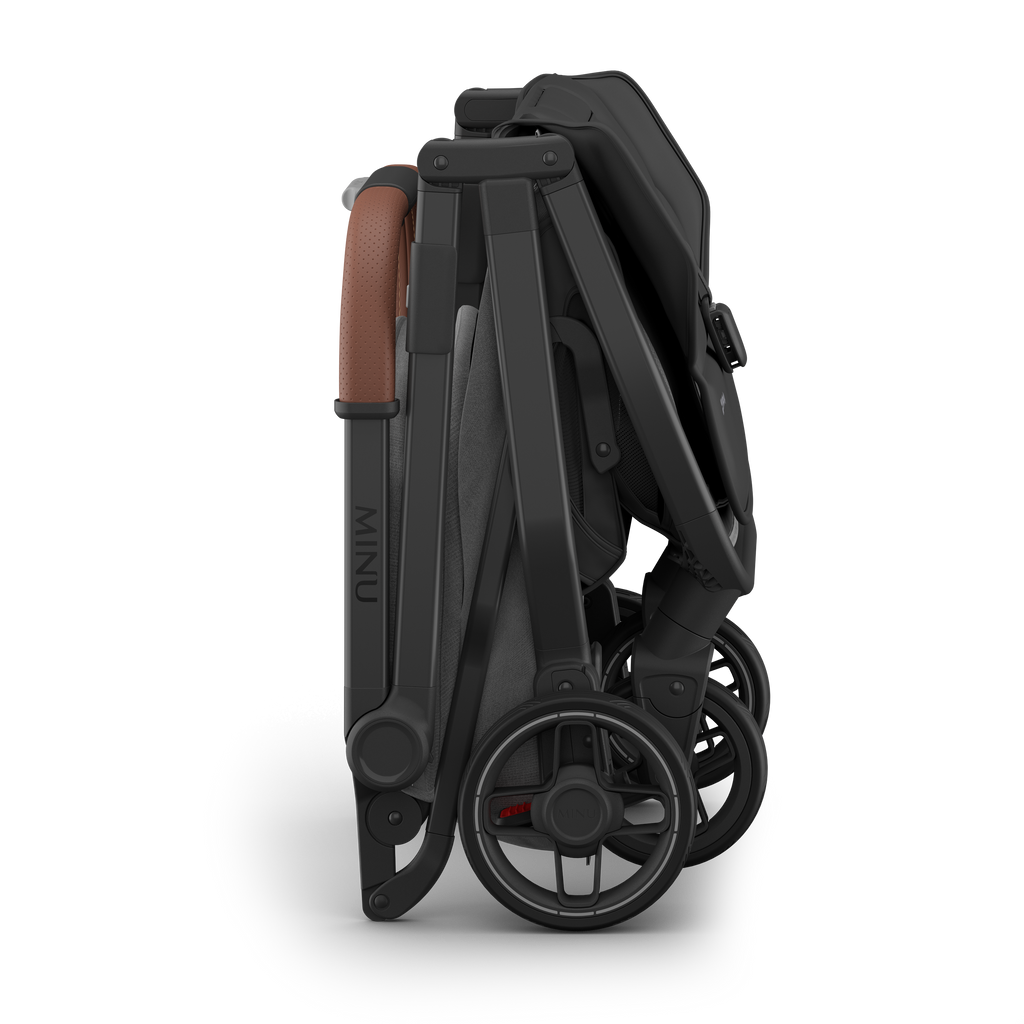 Best travel stroller UPPAbaby Minu V3 Greyson, folded for easy transport.