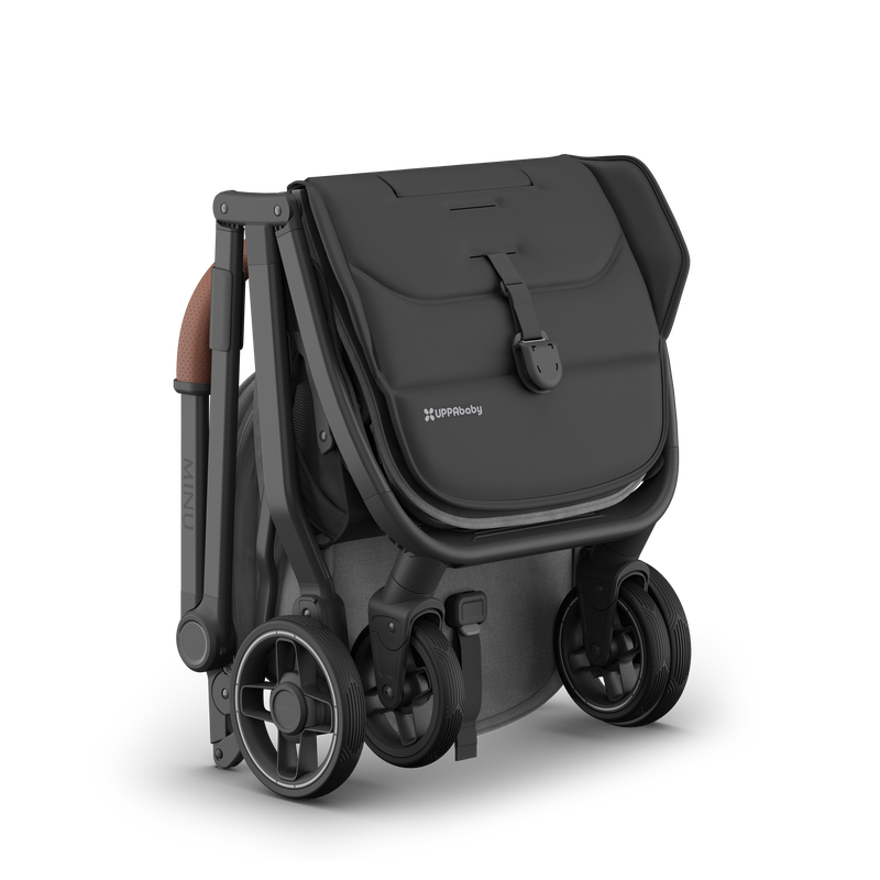 UPPAbaby Minu V3 Greyson stroller, ultra-compact when folded, ideal for small spaces.