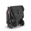 UPPAbaby Minu V3 Greyson stroller, ultra-compact when folded, ideal for small spaces.