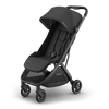 Travel stroller UPPAbaby Minu V3 Jake, side-left hero shot, stylish and lightweight for trips.