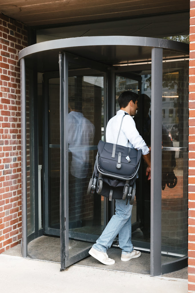 Travel stroller in Jake, UPPAbaby Minu V3 shows its versatility in a comfortable hotel room.