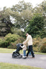 UPPAbaby Minu V3 Jake with PiggyBack in a hotel setting, offering seamless travel stroller options.