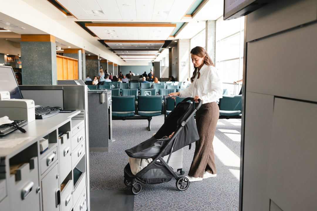 Jake UPPAbaby Minu V3 at the airport Ð a compact, stylish stroller for travel convenience.