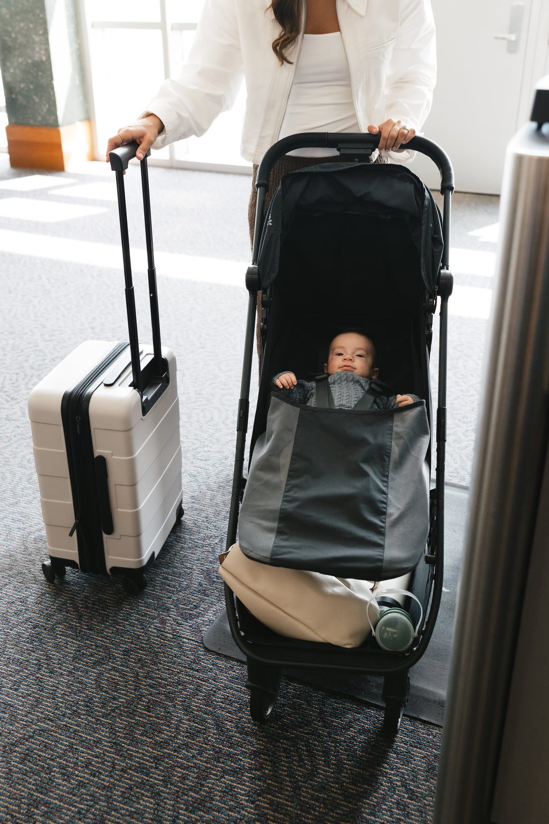 UPPAbaby Minu V3 Jake in the airport Ð lightweight stroller for easy travel with a toddler.