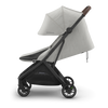 UPPAbaby Minu V3 Savannah in a side left view Ð perfect lightweight stroller for your little one.