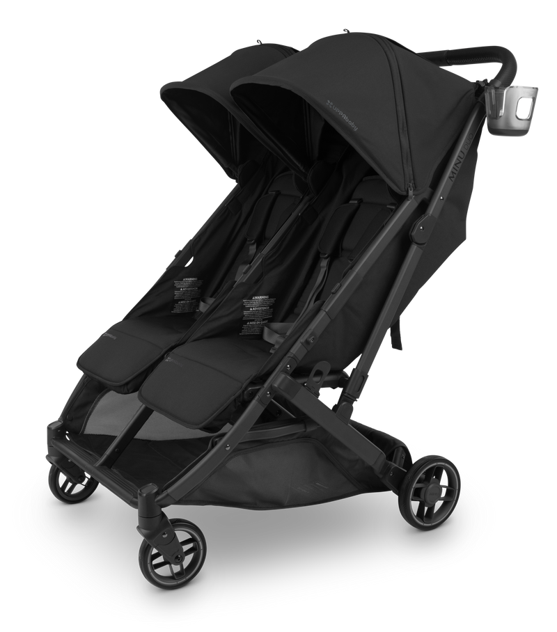 The UPPAbaby Minu V3 Cup Holder attached to the stroller, adding convenience for busy parents.