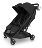 The UPPAbaby Minu V3 Cup Holder attached to the stroller, adding convenience for busy parents.