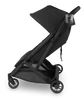 Side view of UPPAbaby Minu V3 Cup Holder, the perfect addition to your lightweight stroller for drink storage.