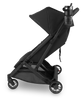 UPPAbaby Minu V3 Cup Holder in action, mounted on the stroller side to hold drinks securely while strolling.