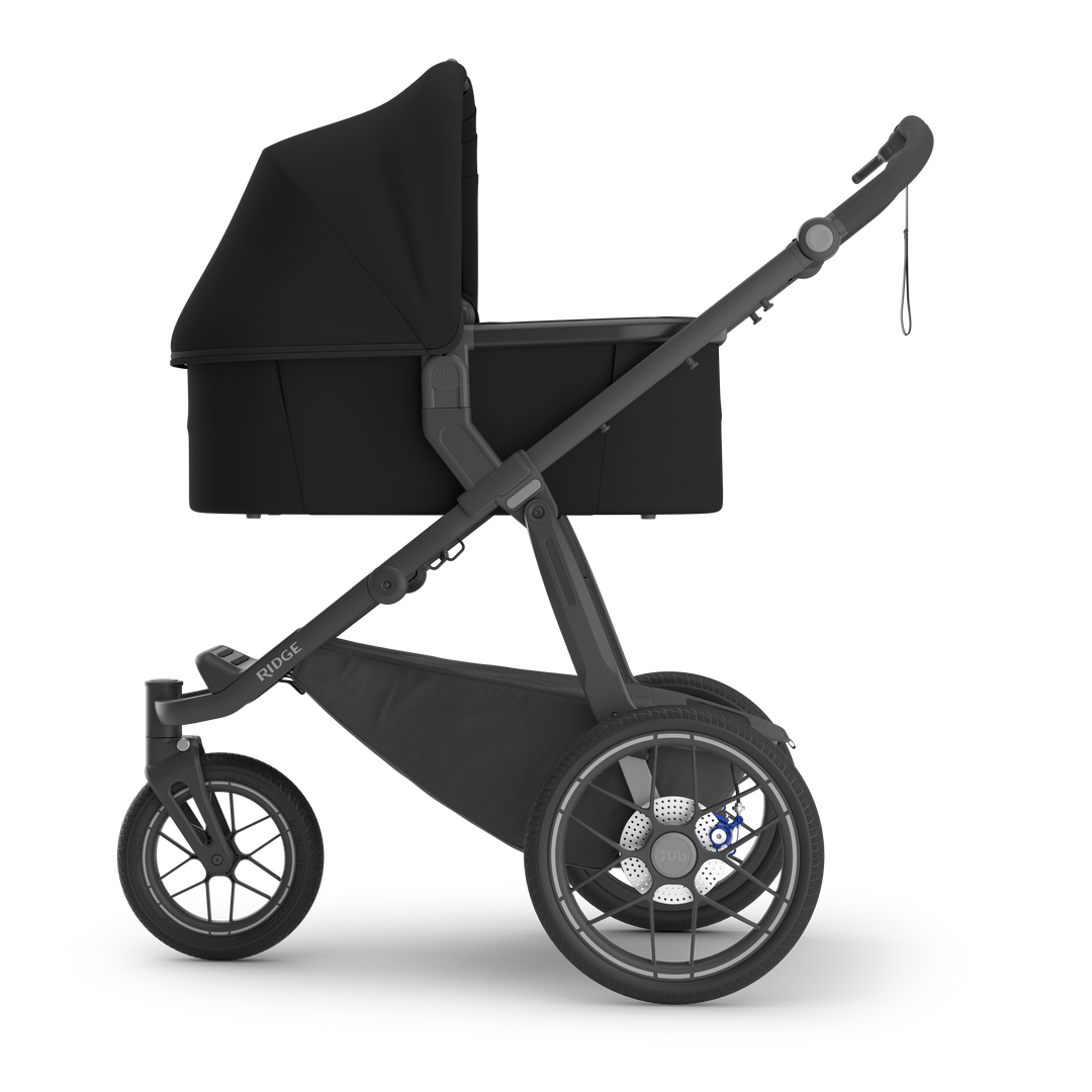 UPPAbaby Bassinet V3 James Black on Ridge stroller side — all-black bassinet compatible with Ridge V2