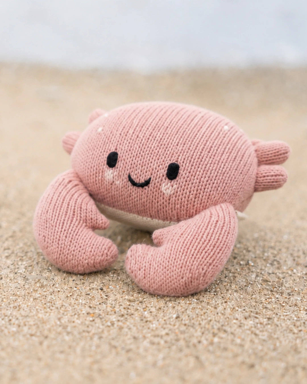 Soft cotton knit crab stuffed animal Cuddle + Kind Baby Crab in Blush, a sweet nursery keepsake