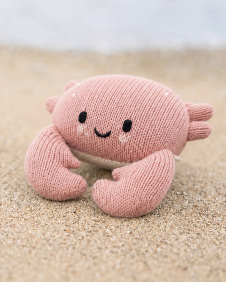 Soft cotton knit crab stuffed animal Cuddle + Kind Baby Crab in Blush, a sweet nursery keepsake