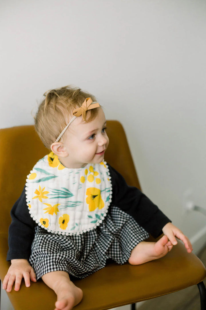 Make mealtime easier with the Clementine Kids Buttercup Blossom Bib, a charming option for bibs for babies.