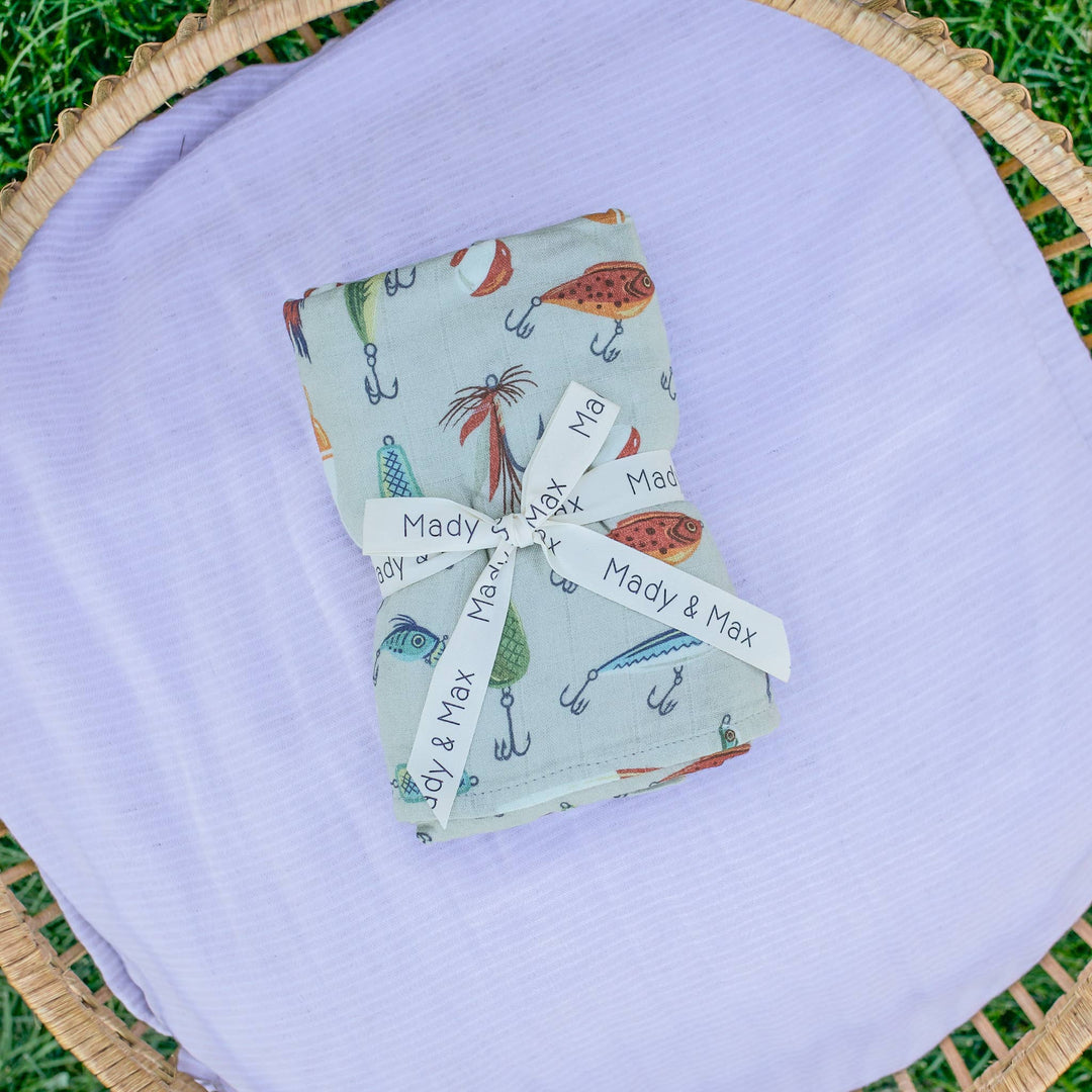 Gone Fishing print muslin swaddle blanket by Mady & Max