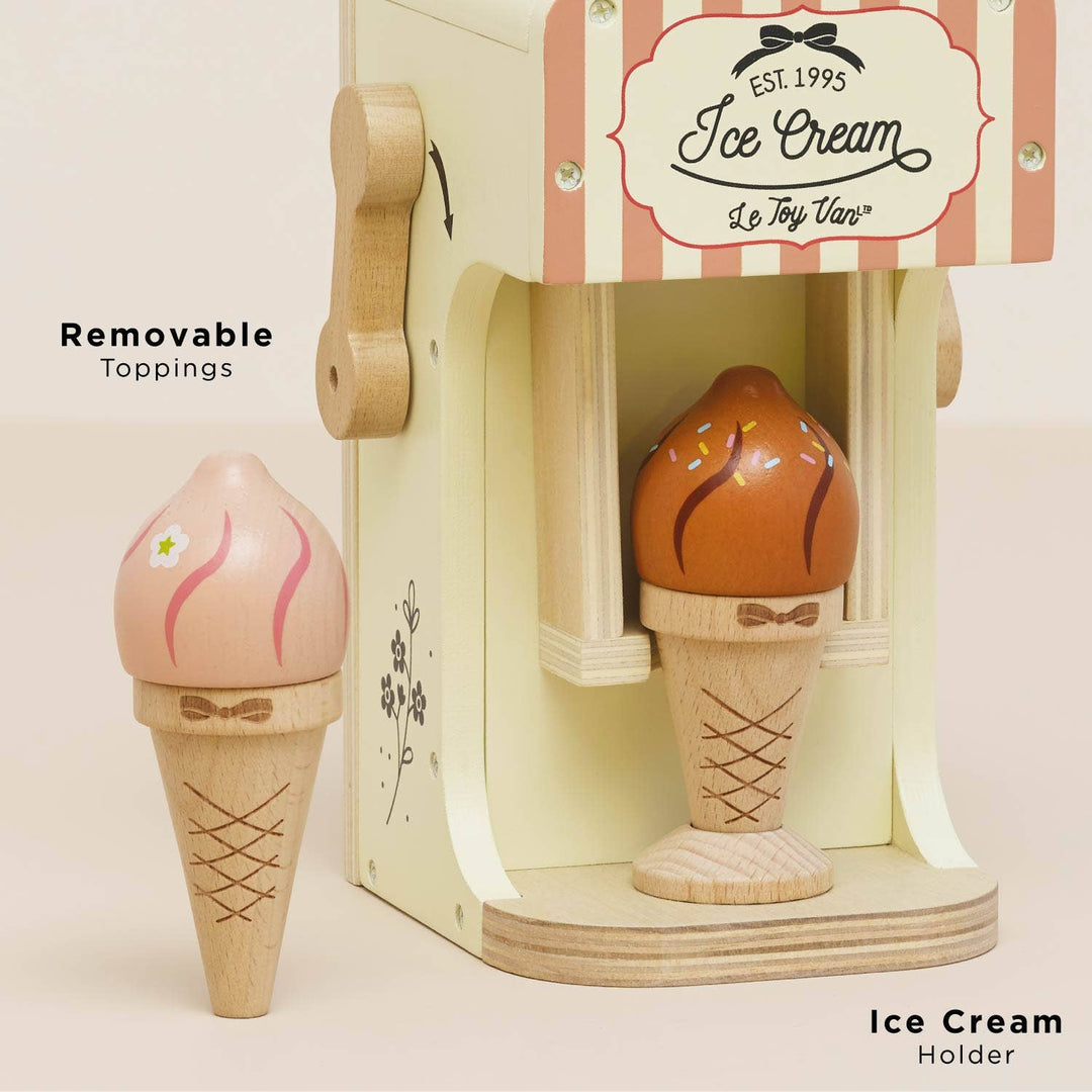 A removable pink swirl cone lifts away from its holder on Le Toy Van's Ice Cream Machine & Cones