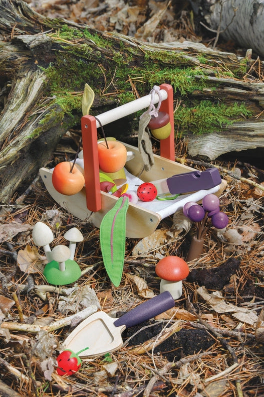 A nature-themed view of the Tenderleaf Wild Wood Foraging Trug, designed as a timeless kid toy for creative play.
