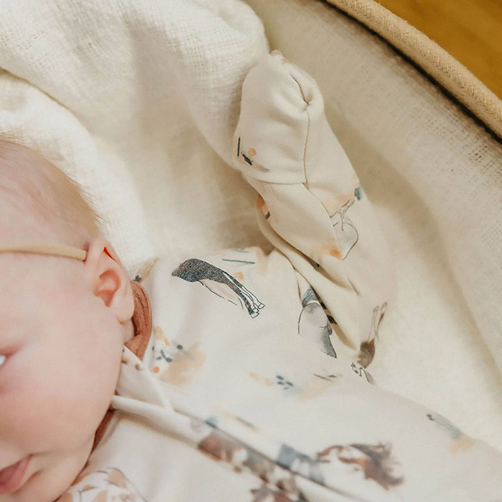 Close up of Copper Pearl Montana baby pajama sleeve and mitten cuff, soft infant sleepwear for warmth and scratch protection