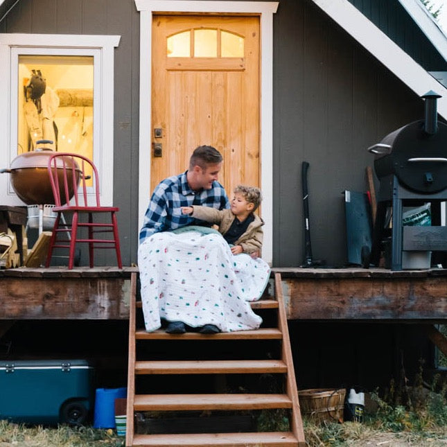 Soft and cozy Little Unicorn Original Cotton Muslin Quilt - Powder Party styled in a nursery, showcasing a premium baby quilts design.