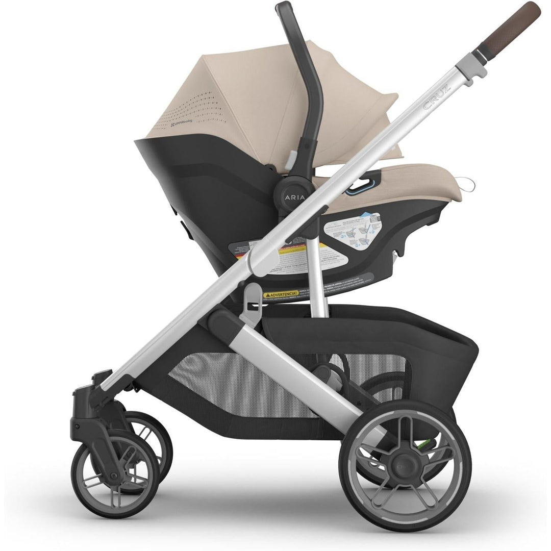 Travel in style with the Uppababy Aria V2 in Declan, a sleek and functional rear facing car seat.