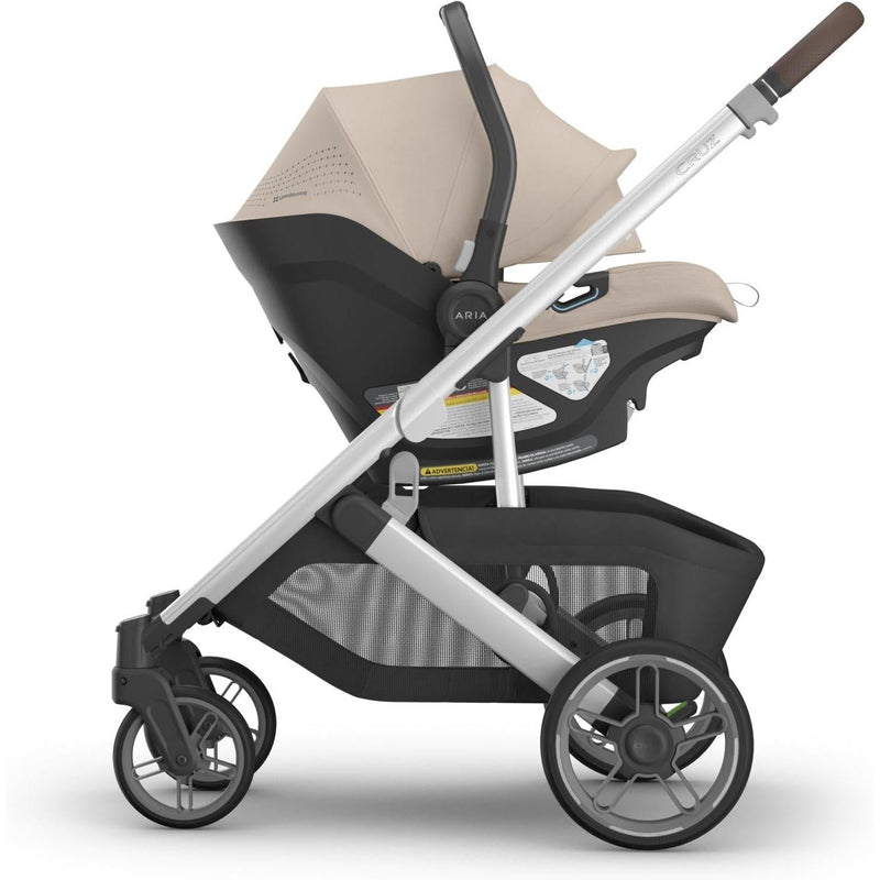 Travel in style with the Uppababy Aria V2 in Declan, a sleek and functional rear facing car seat.