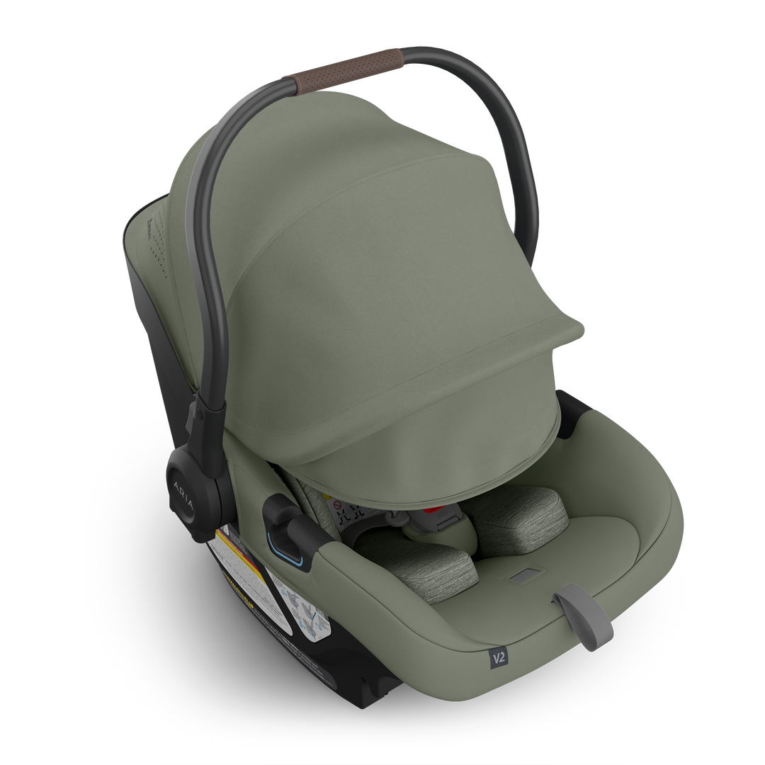 Uppababy Aria V2 Infant Car Seat in Evelyn featuring extended sunshade, providing shade and security in a top-rated rear facing car seat.