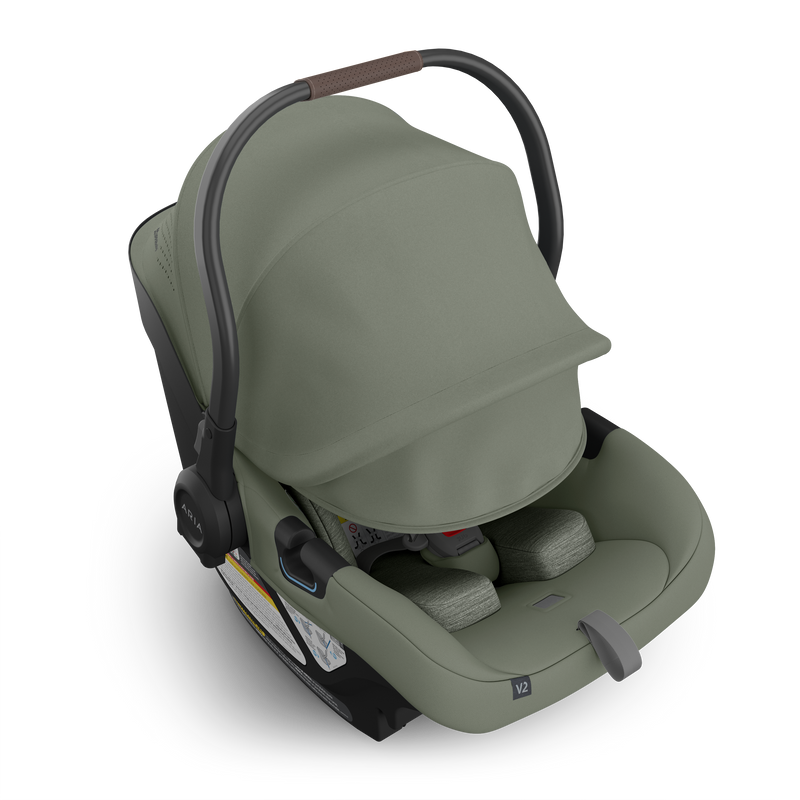 Uppababy Aria V2 Infant Car Seat in Evelyn featuring extended sunshade, providing shade and security in a top-rated rear facing car seat.