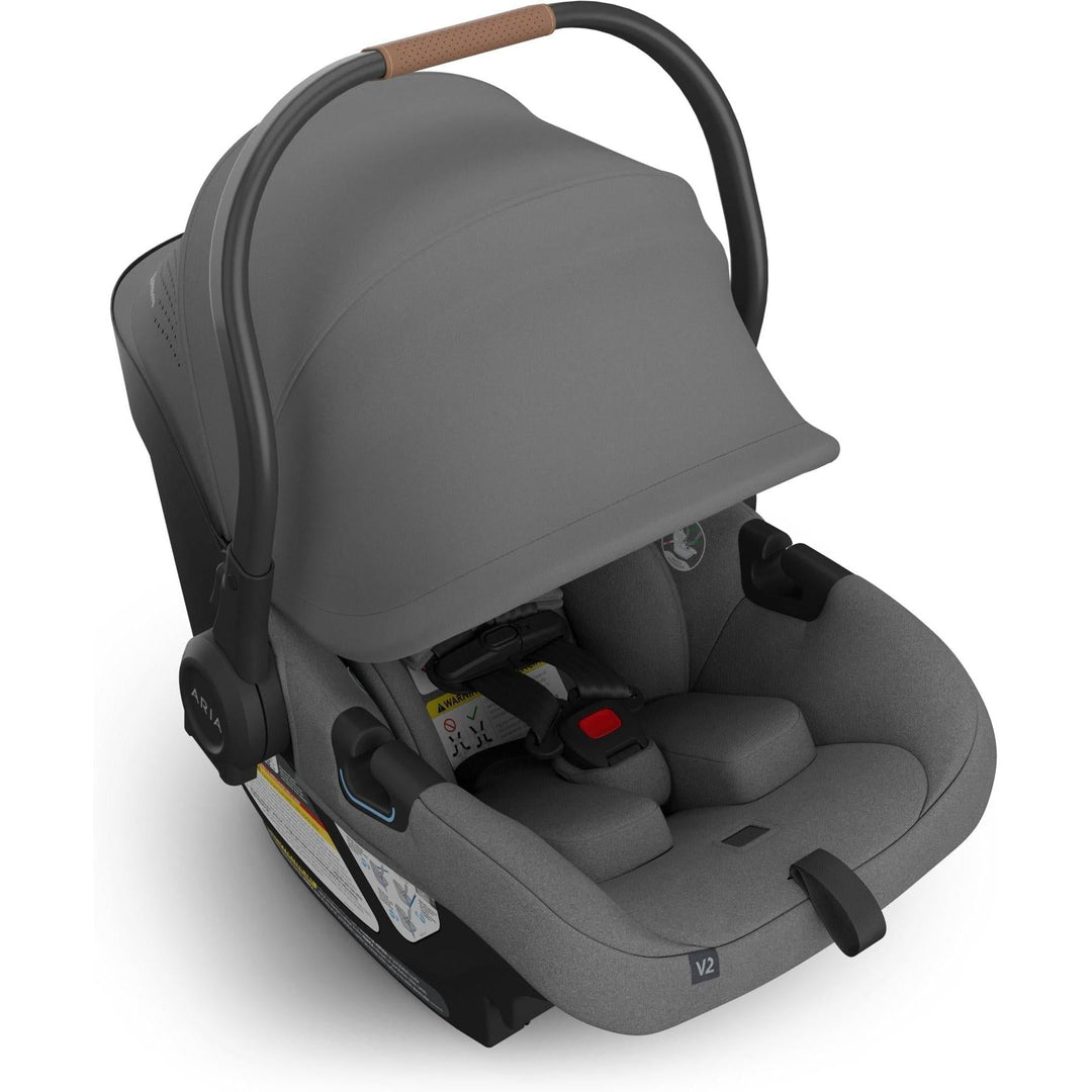 Front-facing angle of Uppababy Aria V2 in Greyson highlights a modern and secure car seat for baby.