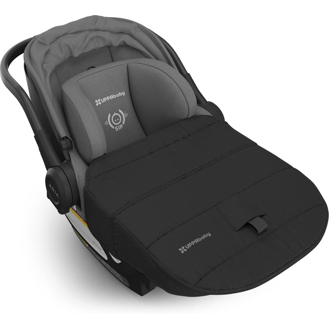 GreysonÕs Uppababy Aria V2 Infant Car Seat showcases a plush foot cover for cozy newborn protection.