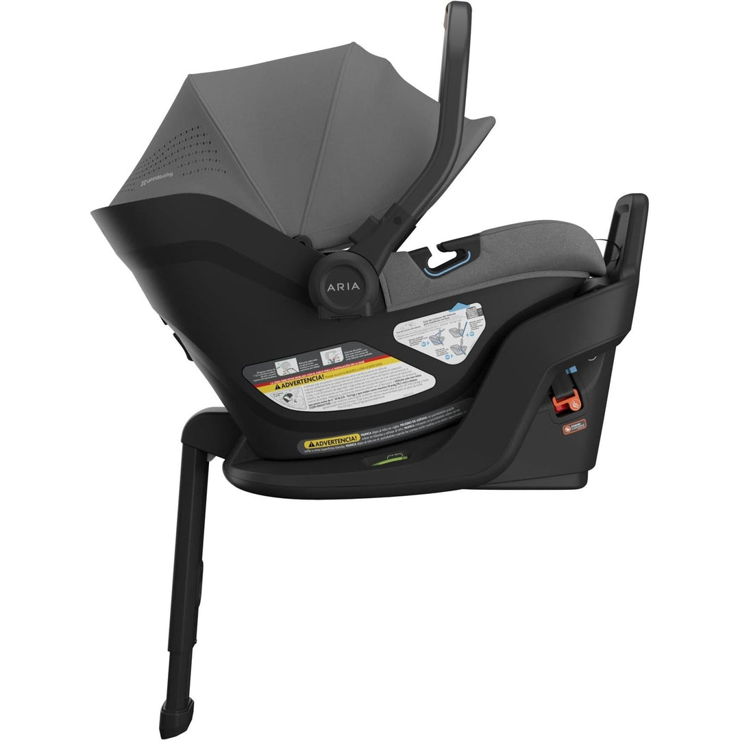 Left side view of the Uppababy Aria V2 in Greyson captures its sleek silhouette and reliable newborn car seat design.
