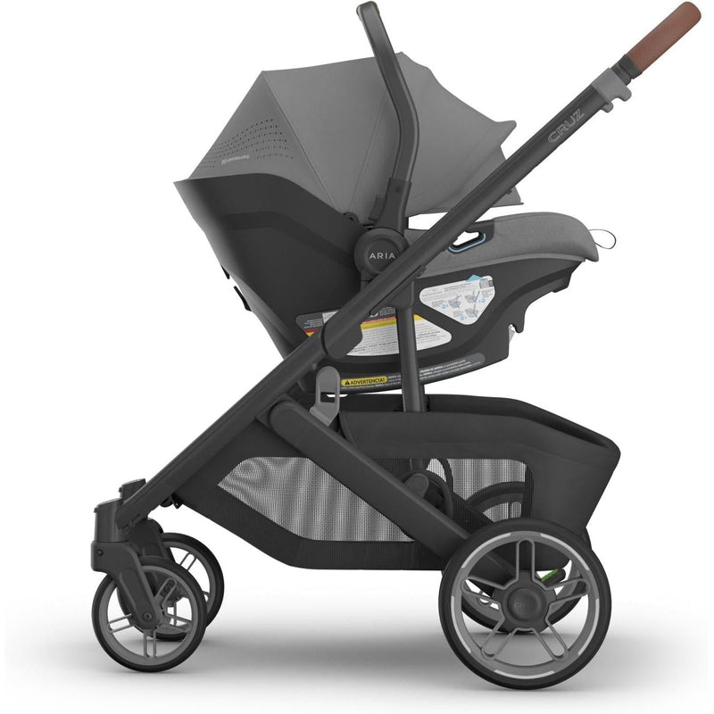 Effortlessly mounted to the Cruz stroller, the Uppababy Aria V2 in Greyson shines as a versatile rear facing car seat.