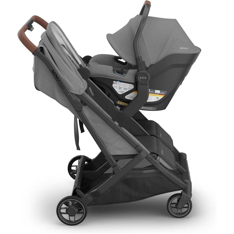 Shown with its Mesa base, the Uppababy Aria V2 in Greyson delivers premium protection as a good travel car seat option.