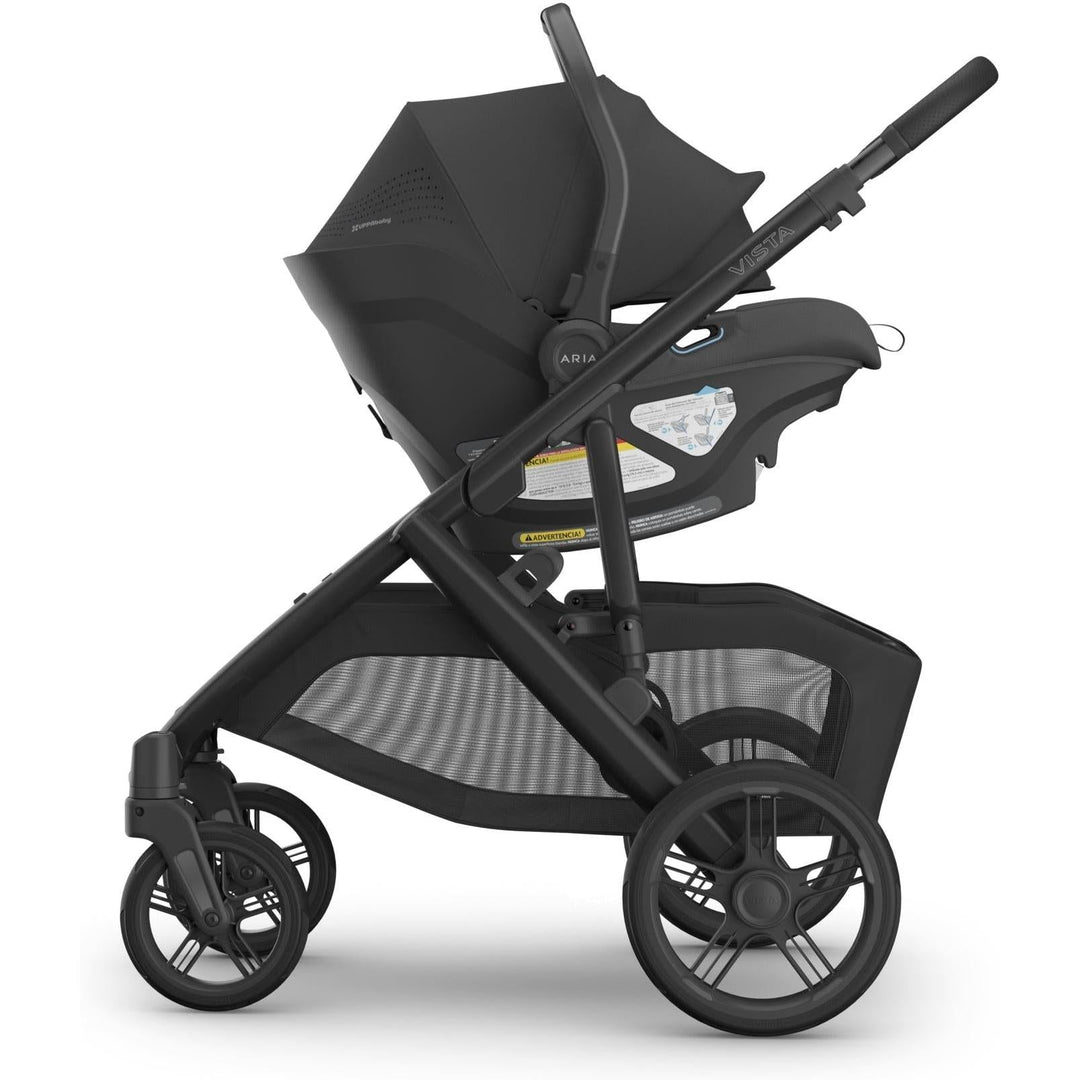 Side profile of the Uppababy Aria V2 Infant Car Seat in Jake shows sleek contours and reliable rear facing car seat design.