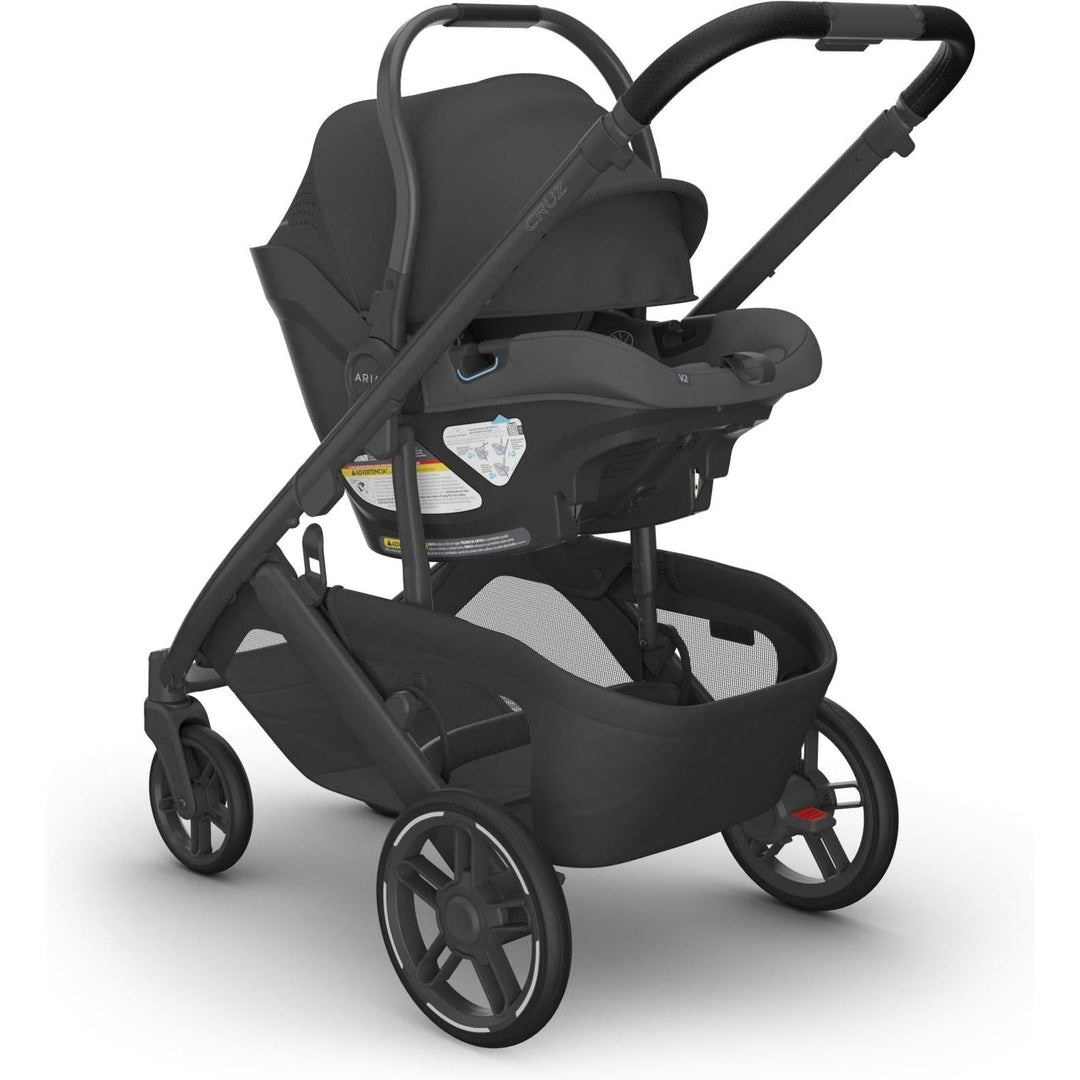 Uppababy Aria V2 in Jake connected to Cruz stroller in full view, ideal for parents seeking the best car seat for newborn.