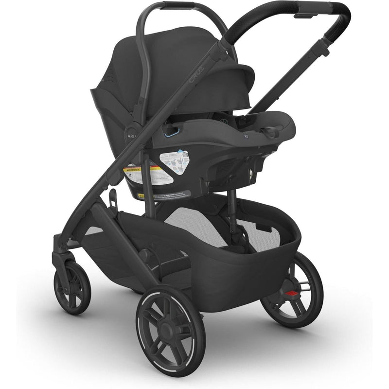 Uppababy Aria V2 in Jake connected to Cruz stroller in full view, ideal for parents seeking the best car seat for newborn.