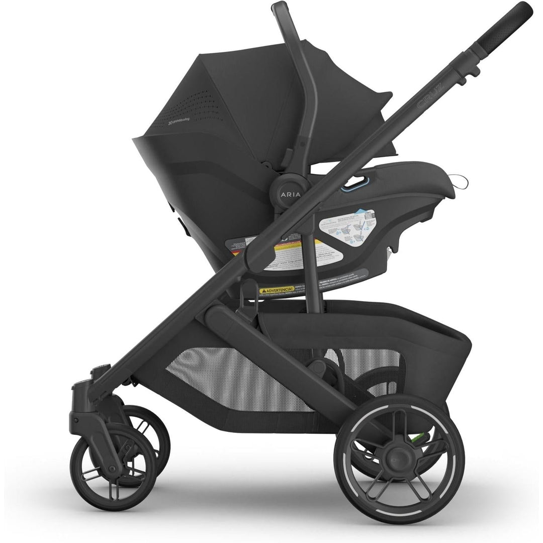 The Uppababy Aria V2 Infant Car Seat in Jake attached to Cruz stroller, offering seamless travel flexibility.