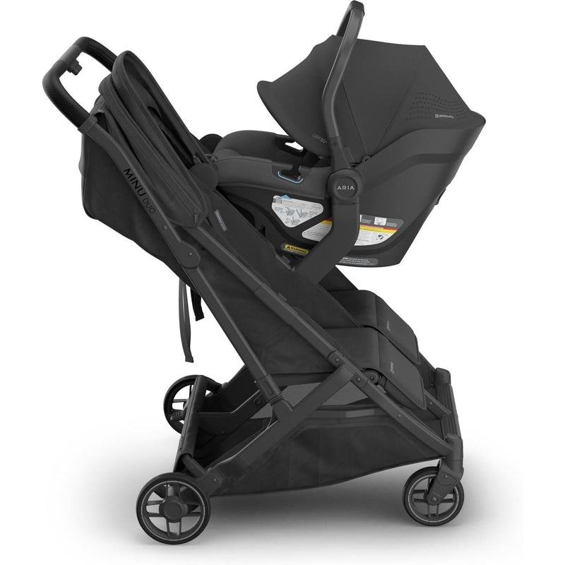 Side view of the Uppababy Aria V2 Infant Car Seat in Jake on Mesa base, crafted for modern travel ease.