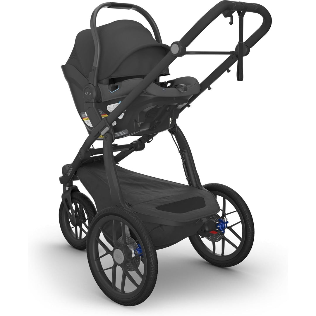 Uppababy Aria V2 Infant Car Seat in Jake securely attached to Ridge stroller, showcasing premium comfort for babies.